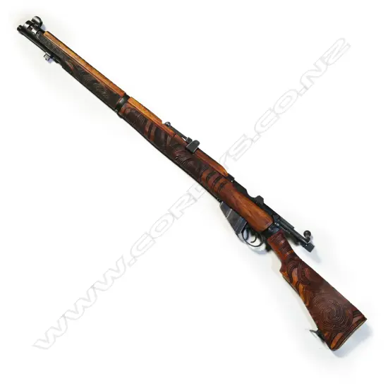 A 1917 WWI Mark 1 dated .303 Lee Enfield rifle with all-over-carved Māori designs attributed to Rangi Redman,